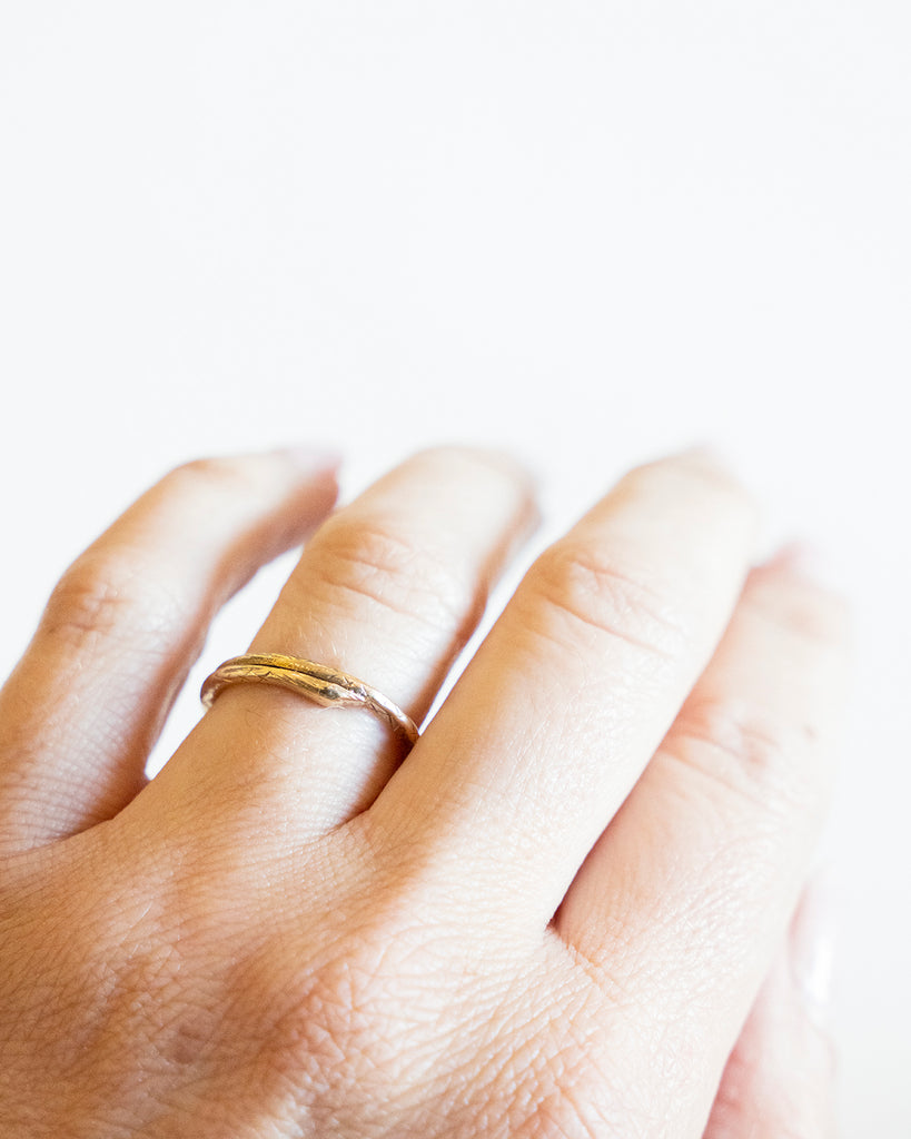 Victorian era snake split ring, in 15k gold. The ends have been soldered closed. England. Circa 1870. The ring being worn to show the scale. 