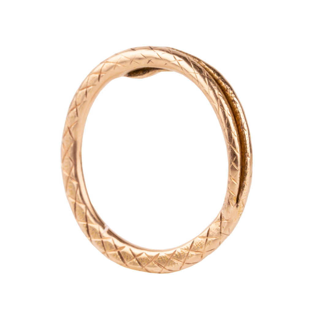 Victorian era snake split ring, in 15k gold. The ends have been soldered closed. England. Circa 1870. Backside profile view. 