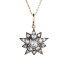 A lovely example of a 19th-century star pendant in silver-topped gold. It is a smaller scale than typically seen and very wearable. Sixteen bright old mine cut diamonds, with an estimated total diamond weight of two carats, English in origin. Circa 1880. Front view. 