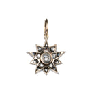 A lovely example of a 19th-century star pendant in silver-topped gold. It is a smaller scale than typically seen and very wearable. Sixteen bright old mine cut diamonds, with an estimated total diamond weight of two carats, English in origin. Circa 1880. Back side view. 