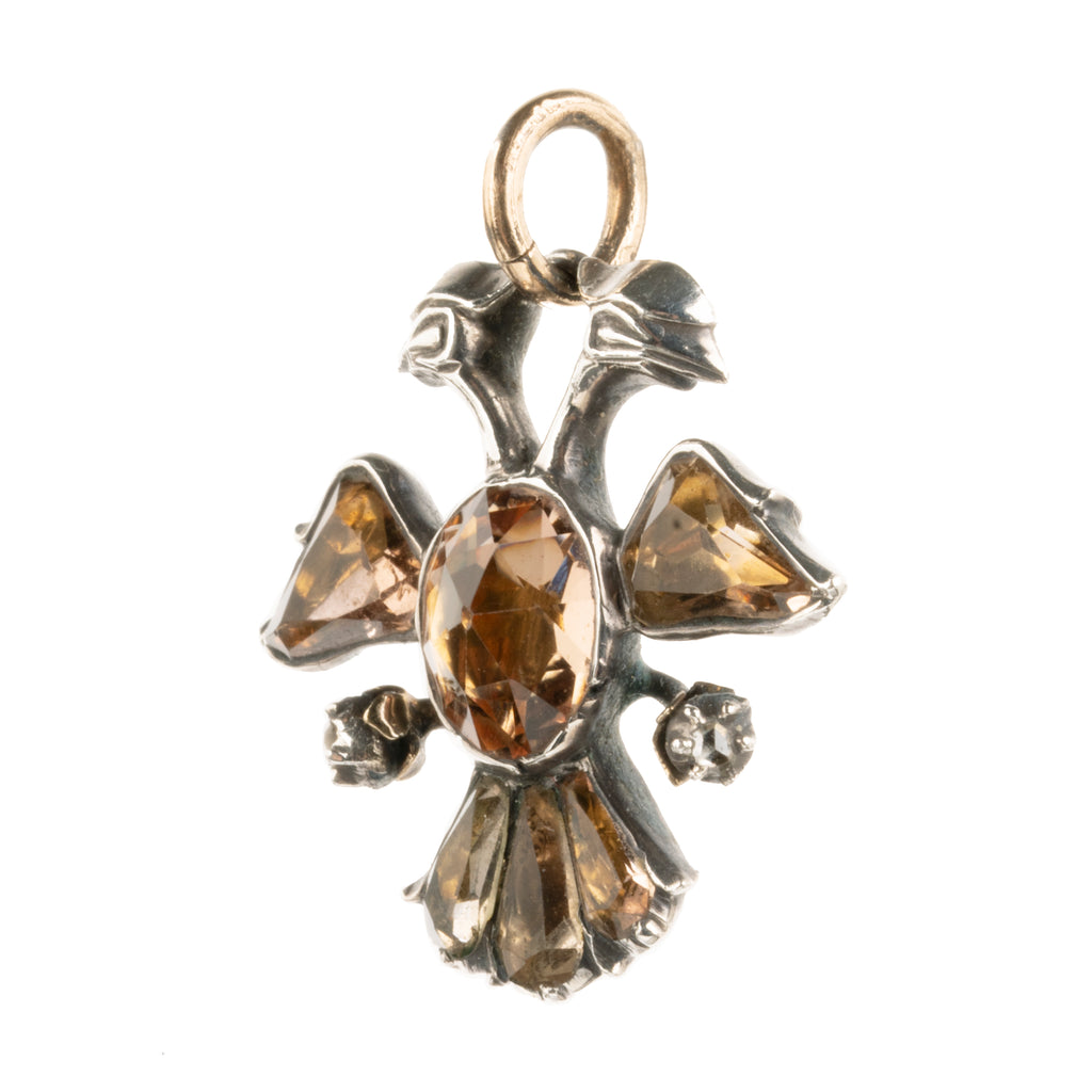 The Double-Headed Eagle is a symbol dating back to ancient cultures such as the Egyptians, Babylonians. This interpretation dates to the late 18th-century and would be Portuguese or Spanish in origin. Circa 1770. Side view.