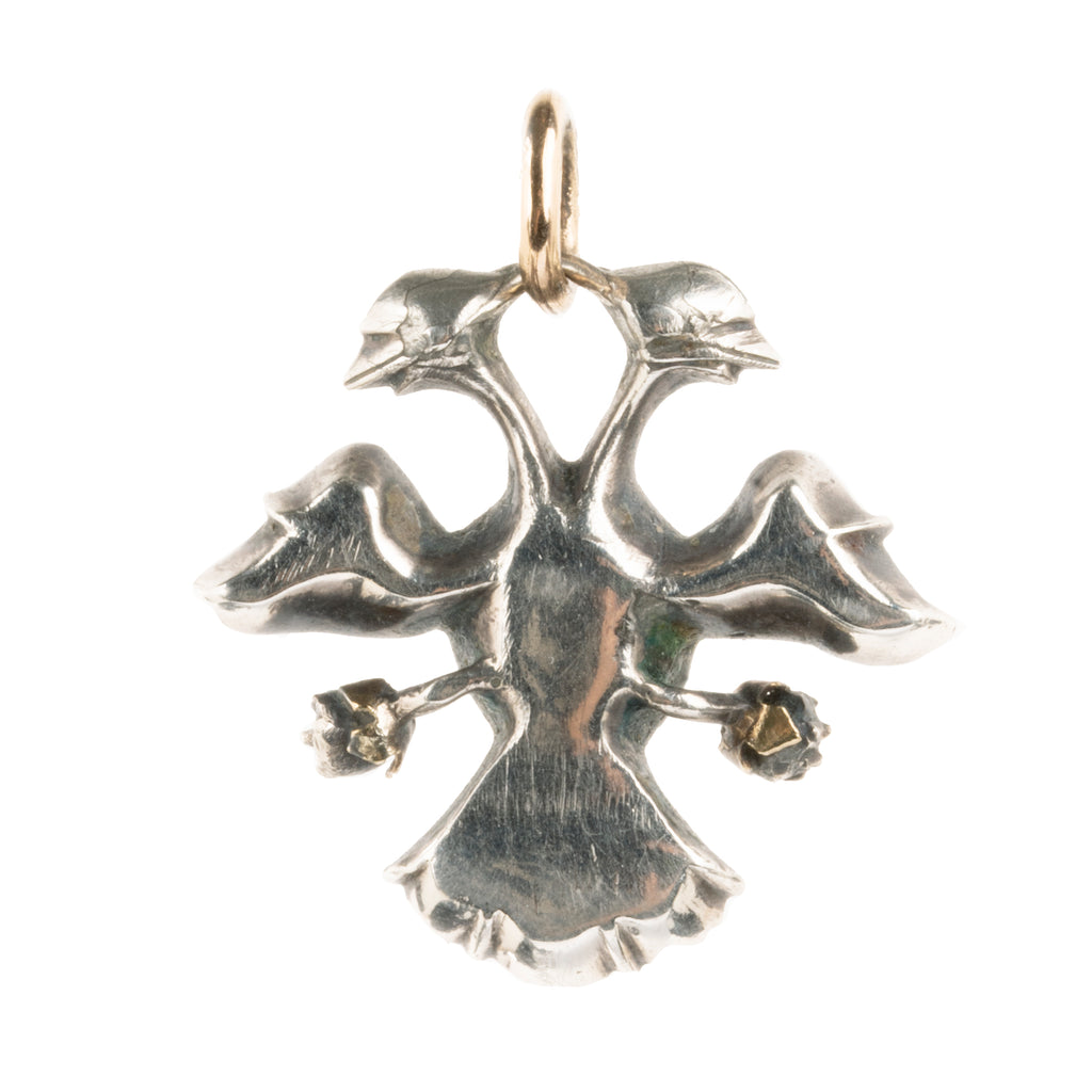 The Double-Headed Eagle is a symbol dating back to ancient cultures such as the Egyptians, Babylonians. This interpretation dates to the late 18th-century and would be Portuguese or Spanish in origin. Circa 1770. Backside view. 