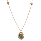Early Victorian era turquoise padlock locket in 15k gold. It is in the form of a shell with Persian turquoise and a glazed compartment.&nbsp; English in origin. Circa 1840. Hanging on an antique 15k gold turquoise beaded ball chain.