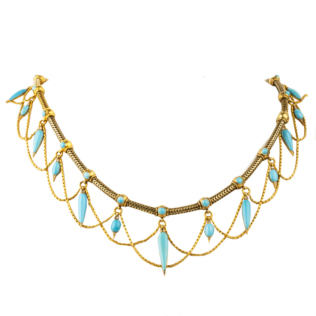 This is a rare example of an elaborate 19th-century collar necklace. Natural Persian turquoise stones are cut in the shapes of amphoras, with rose-cut diamonds set at the sharp tip of every setting. The necklace is made of 18k gold and was made in England, circa 1860. A front view of the necklace. 
