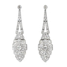 Art Deco Diamond Drop Earrings. A mixture of old mine cut and old European cut diamonds are set in intricate platinum settings. The stones are estimated to weigh approximately 9 carats in total weight. The high-quality stones are estimated to range from F to G in color and VS to SI in quality. America, circa 1920.Front View. 