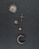 A lovely example of a 19th-century star pendant in silver-topped gold. It is a smaller scale than typically seen and very wearable. Sixteen bright old mine cut diamonds, with an estimated total diamond weight of two carats, English in origin. Circa 1880. Hanging on a wall with other diamond pieces. 