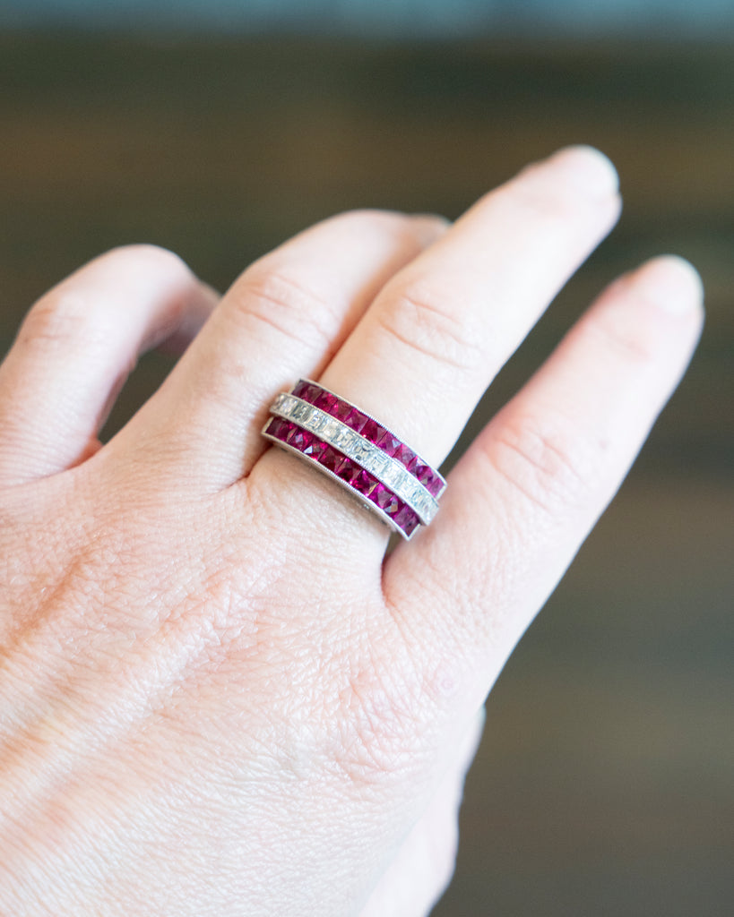 Art Deco style vintage ruby and diamond ring, in platinum setting. Approximately 3.26 carats of bright red French cut rubies and 1.26 carats of French cut diamonds. Being modeled on hand. 
