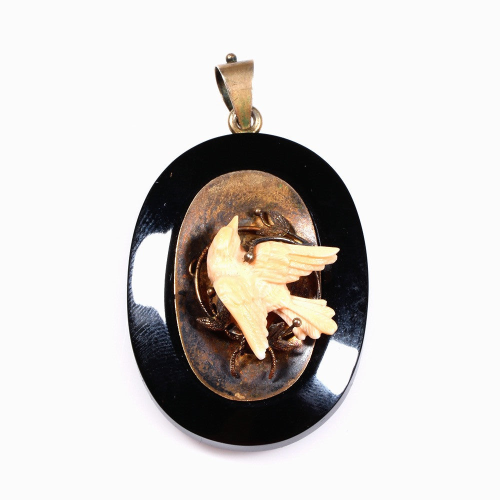 Black Onyx Locket with carved Angel skin Coral Bird in 14k Gold, circa 1870