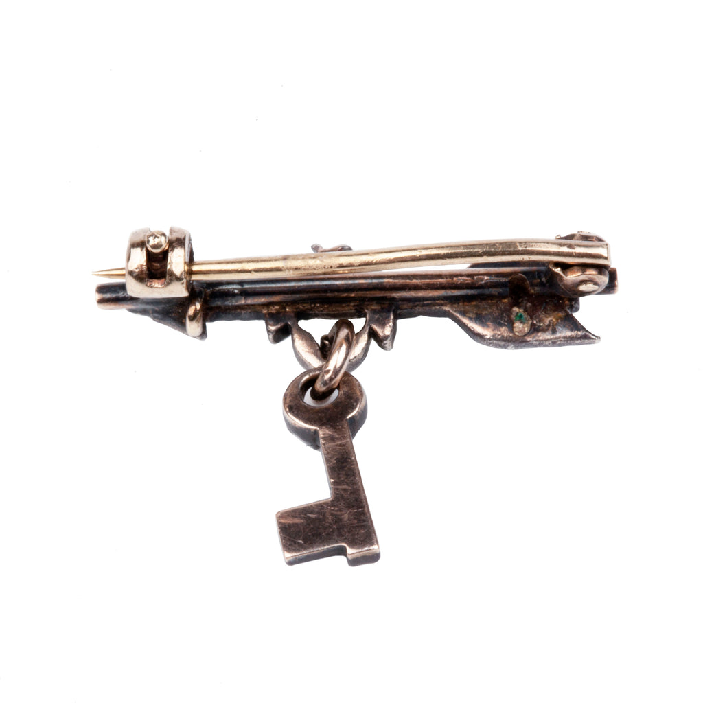 Tiny Victorian era Rose cut diamond arrow brooch with the tiniest key hanging from a laurel wreath. Silver topped gold with original clasp fixture. English in Origin. Circa 1860. Back-up view. 