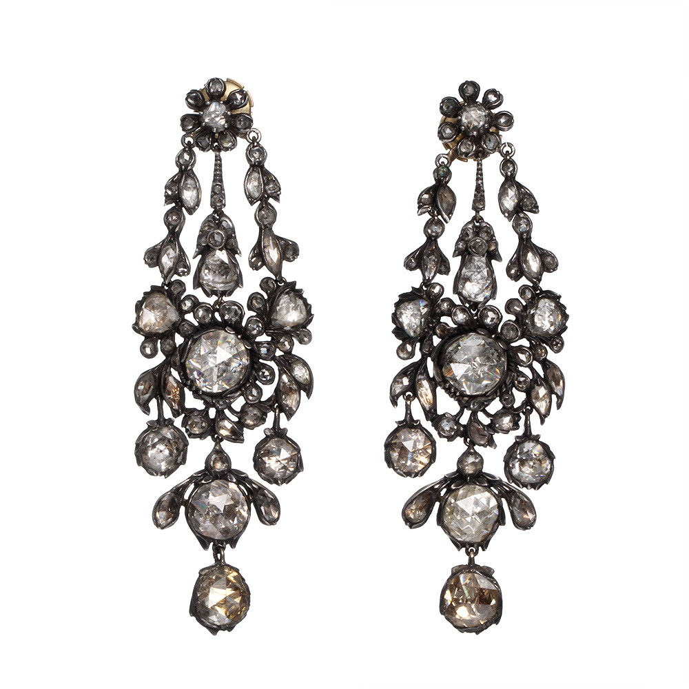 Superb 19th-century diamond earrings in naturalist motifs. Set silver on 18k gold with bright foil-backed settings. The beautiful rose-cut diamonds are estimated to weigh 8 carats in combined weight. There are many hinged elements allowing for lively movement. France, circa 1860. Front view. 