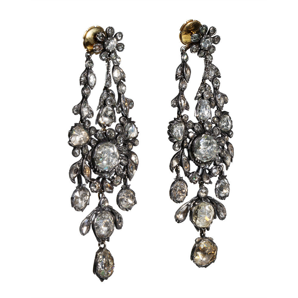 Superb 19th-century diamond earrings in naturalist motifs. Set silver on 18k gold with bright foil-backed settings. The beautiful rose-cut diamonds are estimated to weigh 8 carats in combined weight. There are many hinged elements allowing for lively movement. France, circa 1860. Side view. 