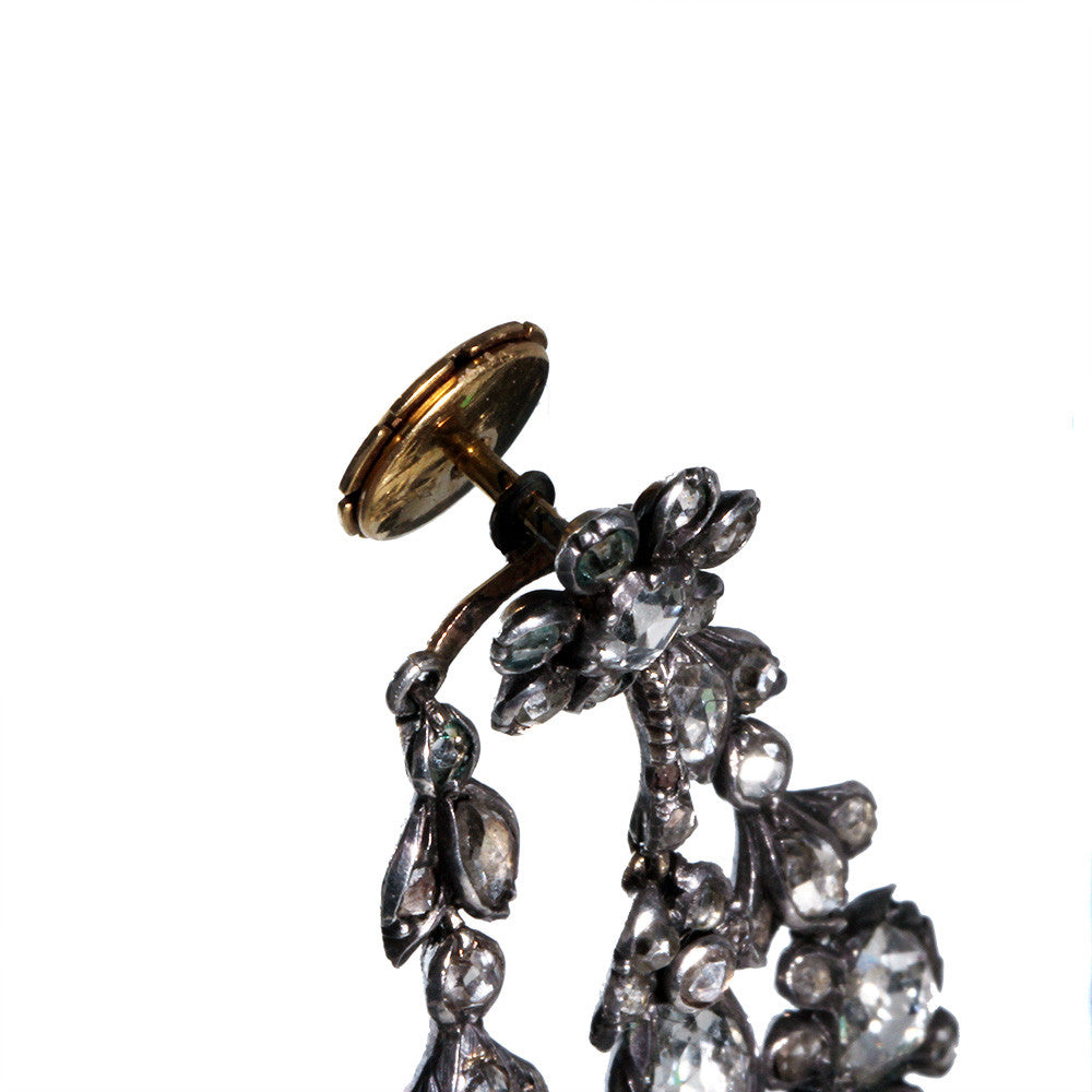 Superb 19th-century diamond earrings in naturalist motifs. Set silver on 18k gold with bright foil-backed settings. The beautiful rose-cut diamonds are estimated to weigh 8 carats in combined weight. There are many hinged elements allowing for lively movement. France, circa 1860. View of the locking backs. 