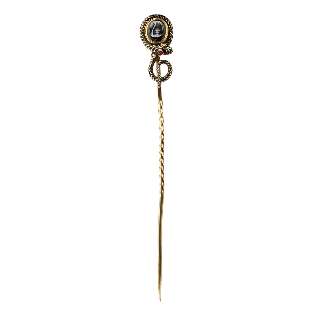 Early Victorian era mourning stick pin with enamel snake and carved hardstone urn, in gold. The mourning piece has engraved "H A & Levett ob& March 12 1847". The original woven hair is the backside locket compartment. Can be worn as an accessory or displayed on the wall as a decorative piece.English in origin. Close up view. 