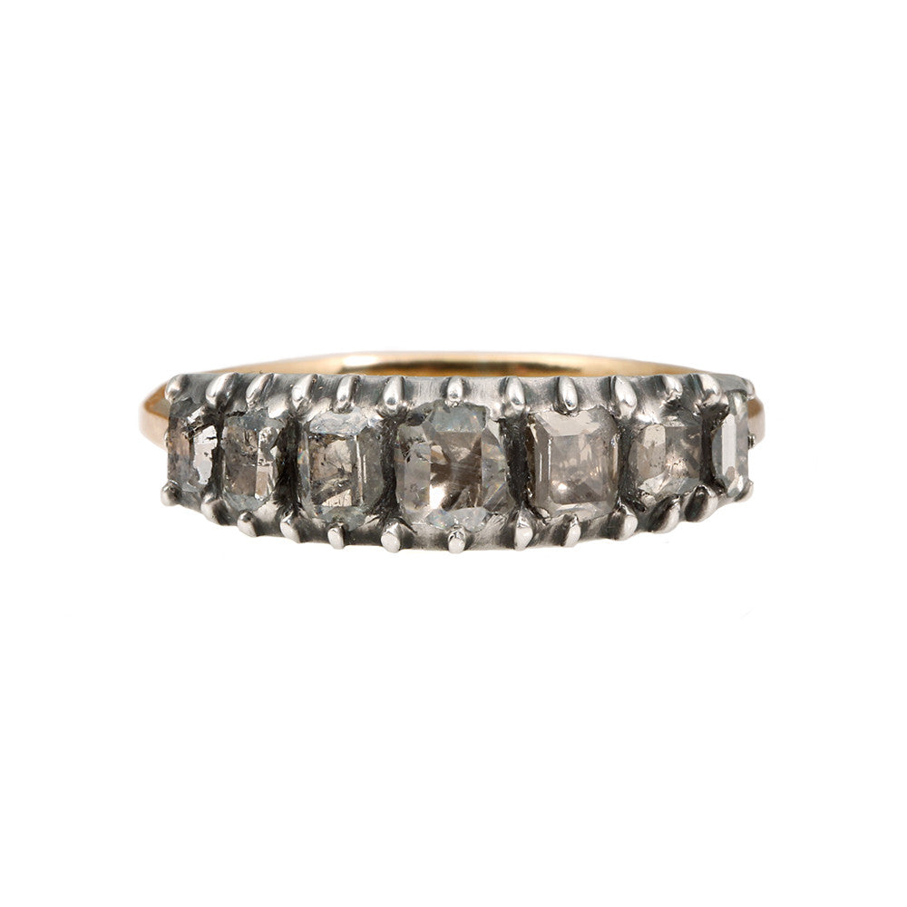 Georgian Era Table cut diamond half hoop band. 7 Table cut diamonds set in a silver closed back setting on a gold band. English in origin, found in London. Circa 1810. Front view. 